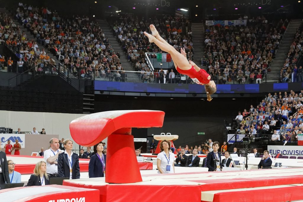 Woman Jumping High for European Artistic Gymnastics Championships