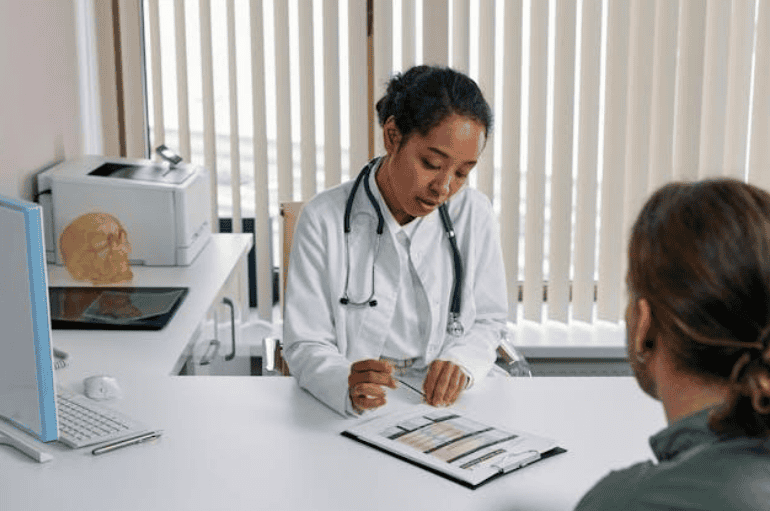 A doctor speaking to a patient